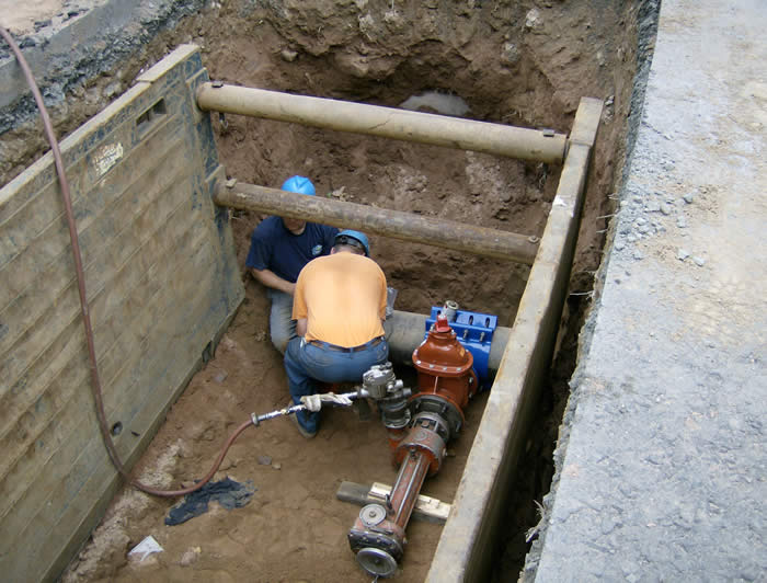 Workers installing line at Business Park Drive